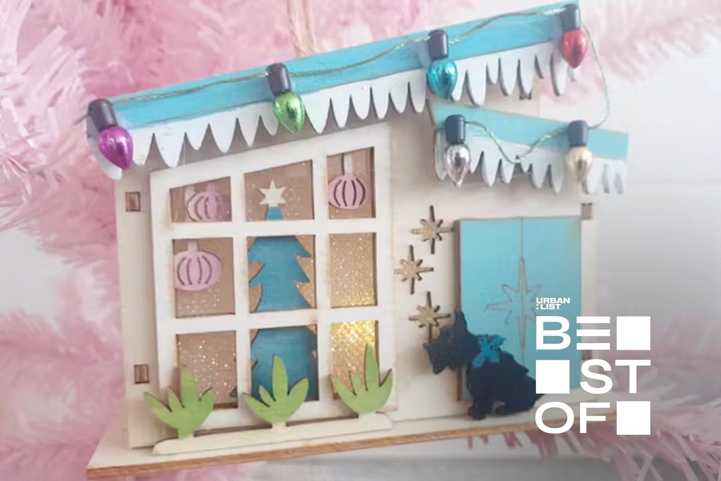 A cute Christmas decoration made from a blue-roofed vintage house.